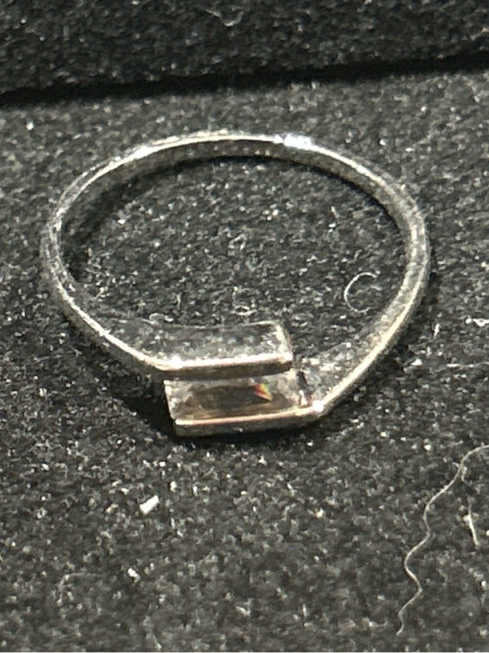 Silver color ring with clear stones around size 6.5